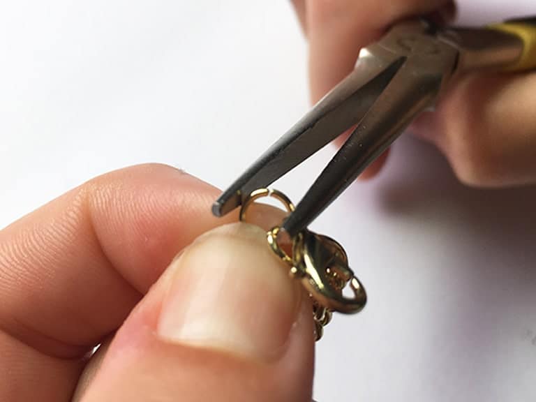 Last use a jump ring to attach a lobster clasp to the end of the chain.