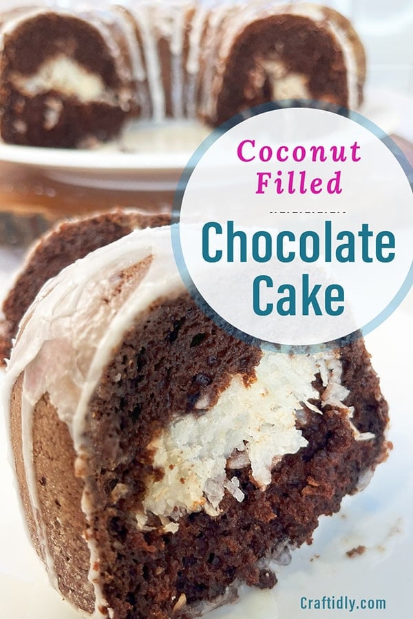 Vertical image to save to your Pinterest recipe board to come back to this dessert recipe later! The image shows a closeup of a slice of moist chocolate cake filled with luscious coconut filling. In the background is the Bundt cake cut into so you can see the coconut tunnel throughout.
