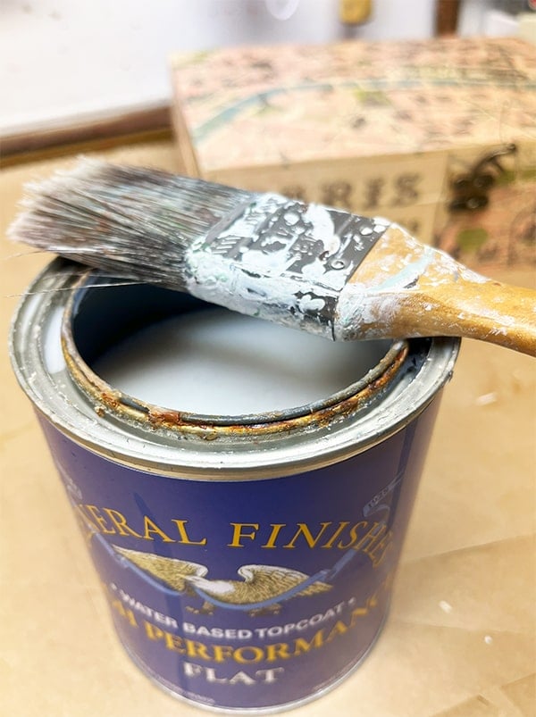 As a recommended last step, coat your finished decoupaged box with General Finished top coat. Here I'm using Flat, or use any polyurethane. You could also coat the art with a thin layer of Mod Podge.
