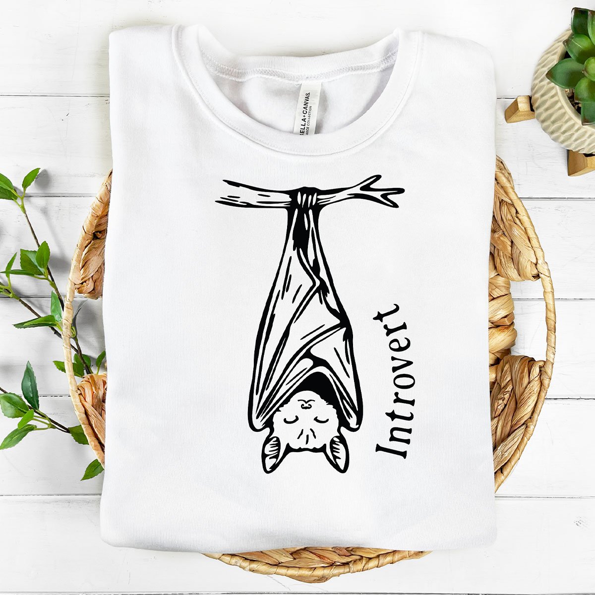 Square feature image of a hare leaping through ferns and over whimsical mushrooms. This boho linocut block illustration is one color- one cut file layer for Cricut, sublimation, digital stencil, and paper crafts. 