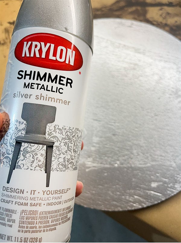 Spray paint your wood board with silver spray paint.