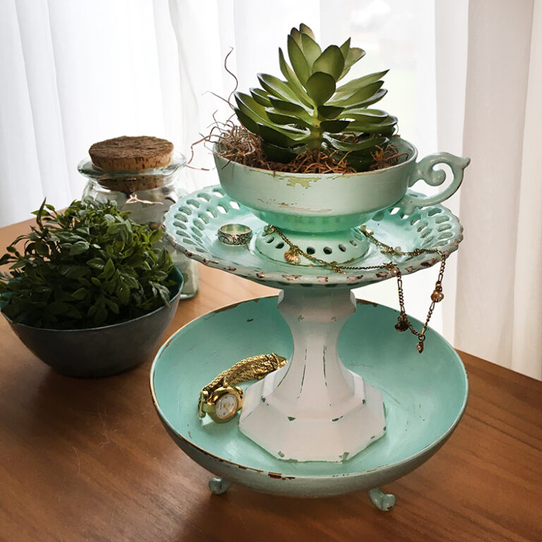 Teacup Tiered Tray finished with a succulent in the teacup with jewelry on the tiers.
