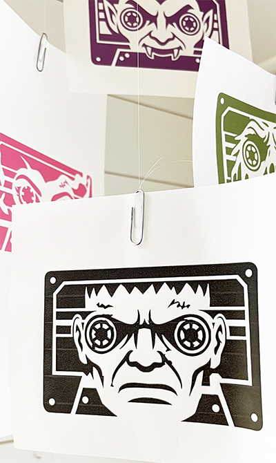 Retro-inspired Halloween Monster Cassette tape illustration collection featured on floating vellum installation.